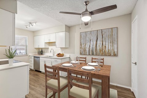 an open kitchen and dining room with a table and chairs at Acacia Gardens, Albuquerque, NM